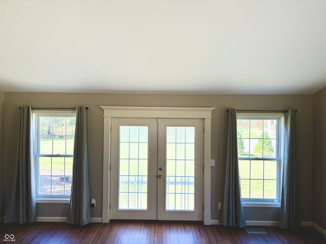 entryway featuring dark hardwood / wood-style flooring and french doors