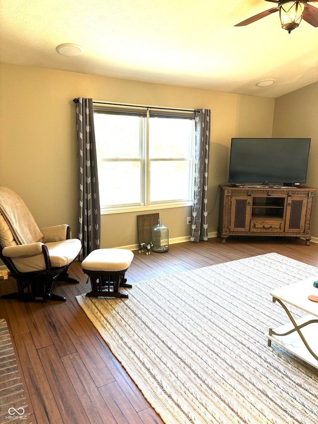 sitting room featuring ceiling fan and hardwood / wood-style flooring