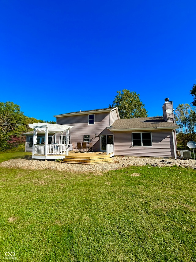 rear view of house featuring a pergola, a wooden deck, a yard, and cooling unit