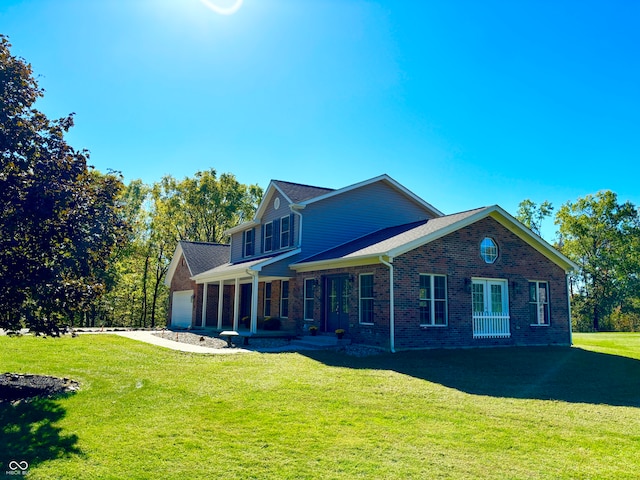 view of front of house featuring a front lawn and a garage