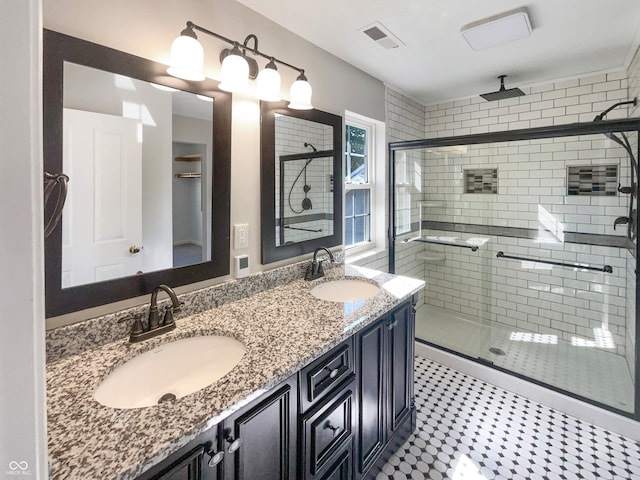 bathroom with vanity and an enclosed shower