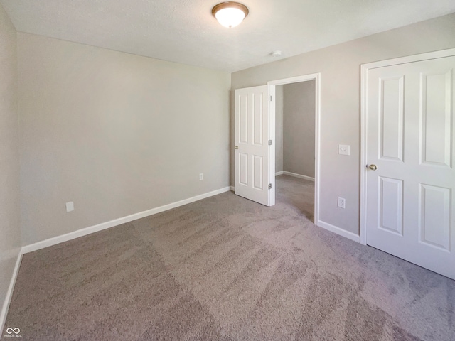 unfurnished bedroom featuring carpet flooring