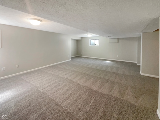 basement with a textured ceiling and carpet