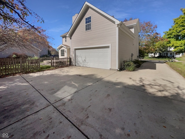 view of property exterior with a garage