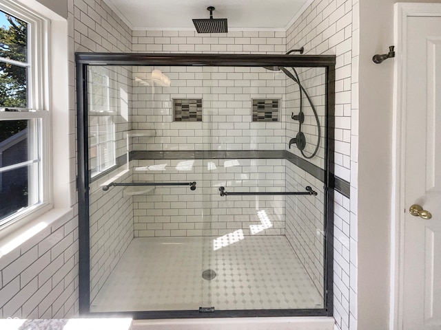 bathroom with walk in shower and tile walls