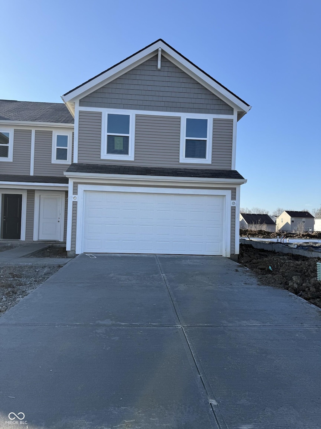 traditional-style home featuring driveway