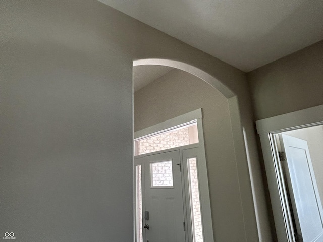 foyer featuring arched walkways