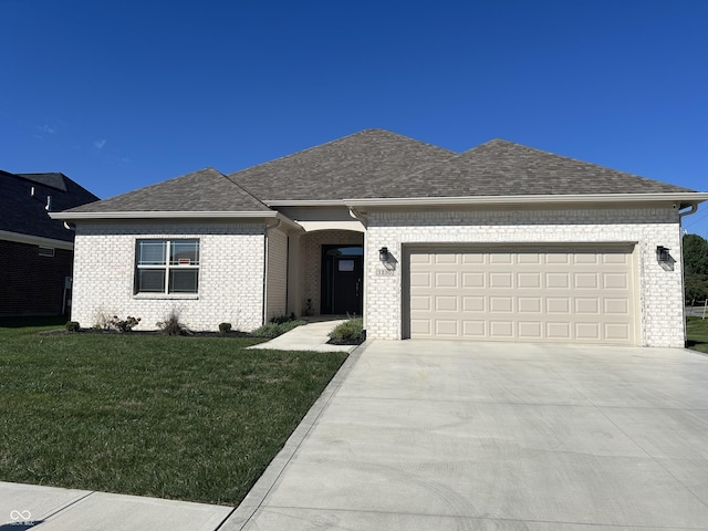ranch-style house featuring concrete driveway, an attached garage, a front lawn, brick siding, and a shingled roof