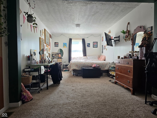 bedroom with a textured ceiling and carpet floors