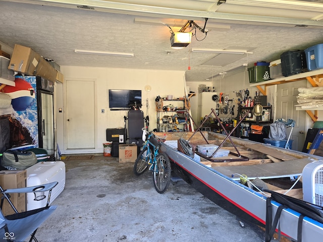 garage featuring a workshop area and a garage door opener