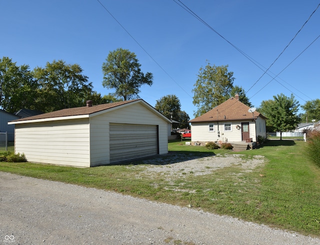 garage featuring a yard