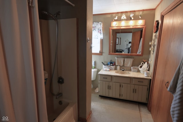 full bathroom featuring vanity, shower / bath combo with shower curtain, and toilet