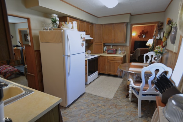 kitchen with crown molding and white appliances