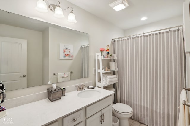 bathroom featuring walk in shower, vanity, toilet, and tile patterned floors