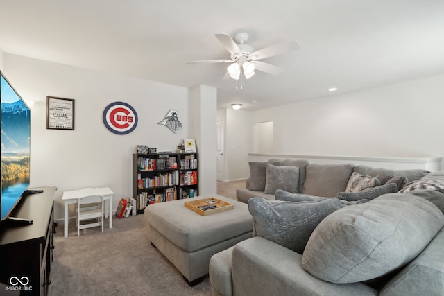 carpeted living room featuring ceiling fan