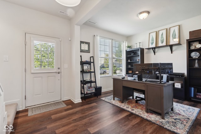 office featuring dark hardwood / wood-style flooring and a healthy amount of sunlight