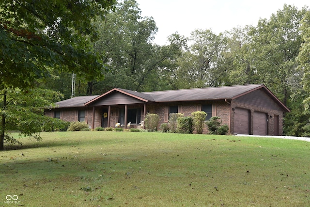 ranch-style home featuring an attached garage, a front lawn, and brick siding