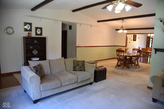 living area with ceiling fan with notable chandelier, baseboards, vaulted ceiling with beams, and carpet flooring
