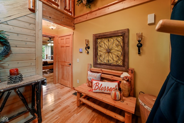 sitting room with light wood-type flooring and ceiling fan