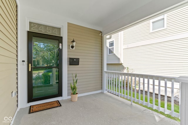 doorway to property featuring a porch