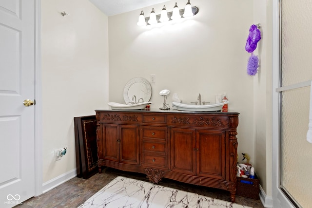 bathroom with a shower with shower door and vanity