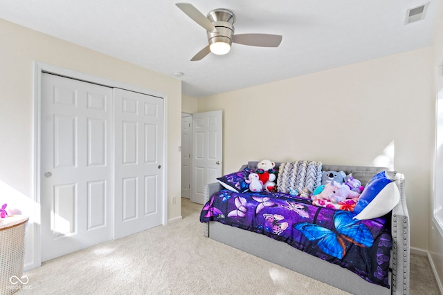 bedroom with a closet, carpet flooring, and ceiling fan