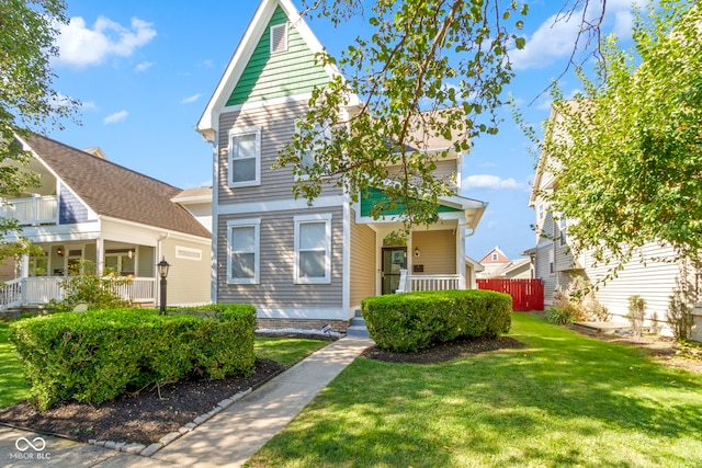 view of front property with a porch and a front lawn