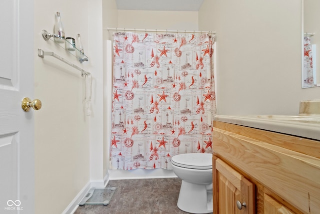 bathroom with vanity, walk in shower, and toilet