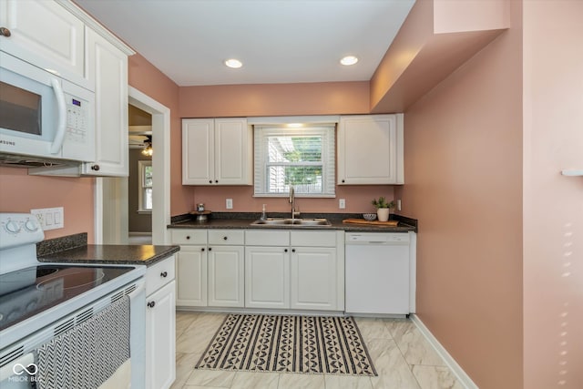 kitchen with white cabinets, ceiling fan, white appliances, and sink