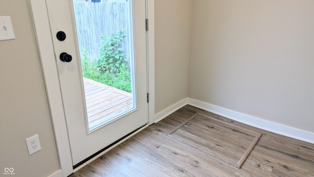 doorway to outside with light hardwood / wood-style flooring