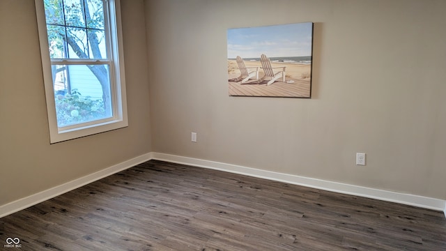 spare room featuring dark hardwood / wood-style floors