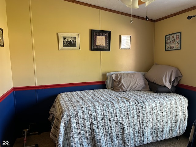 bedroom with crown molding, a textured ceiling, and dark colored carpet