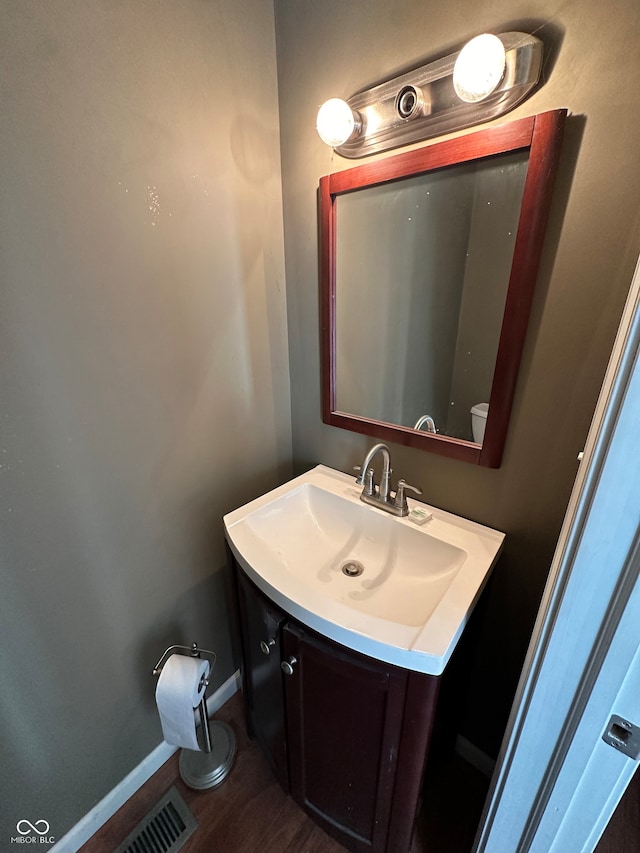 bathroom featuring vanity and wood-type flooring