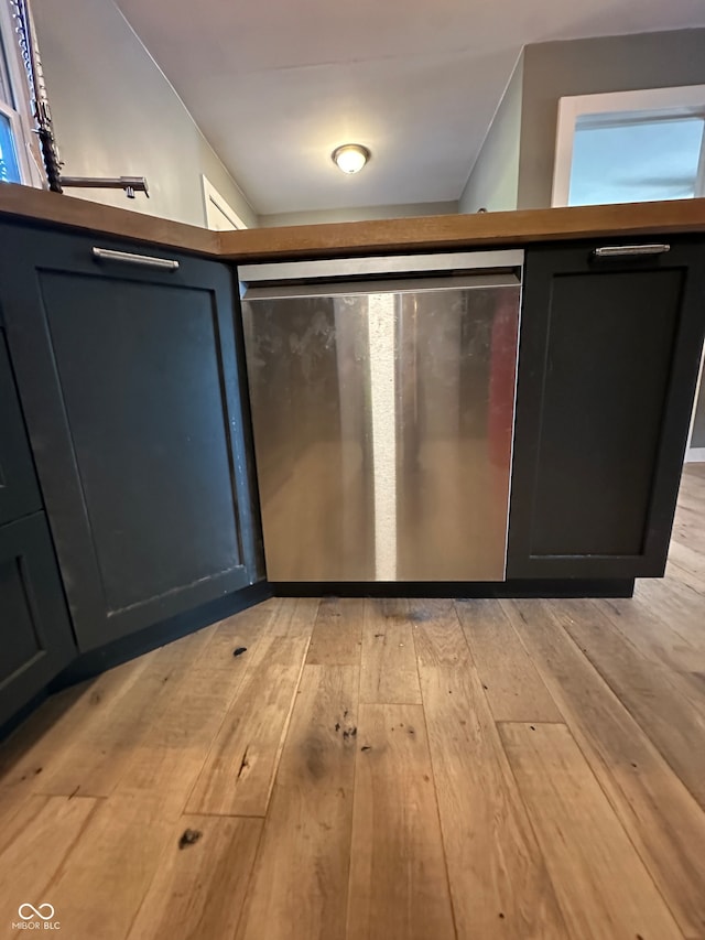 kitchen with light hardwood / wood-style flooring and stainless steel fridge