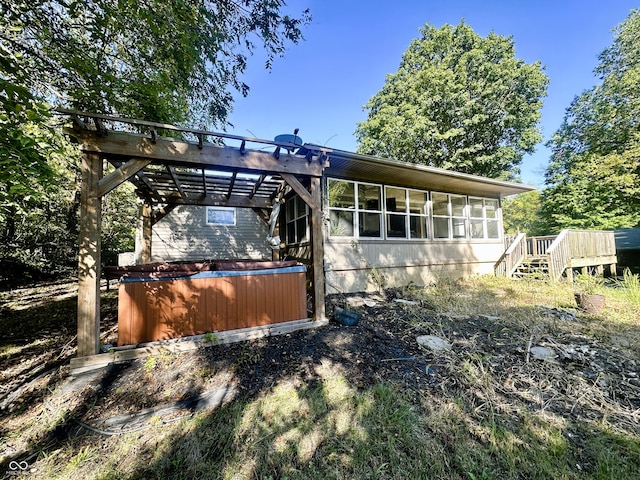 view of property exterior featuring a sunroom