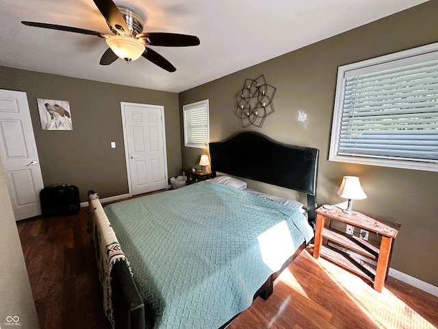 bedroom with hardwood / wood-style floors and ceiling fan