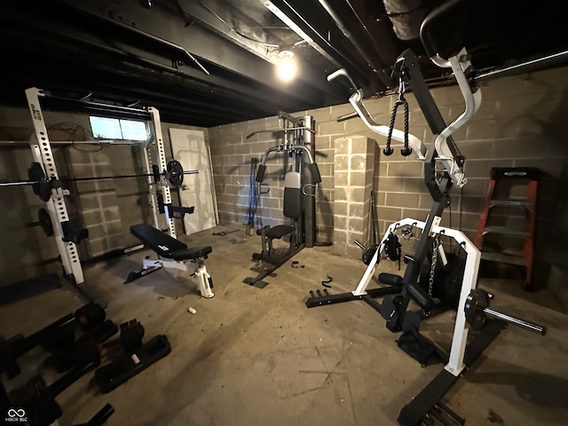 exercise room featuring concrete flooring