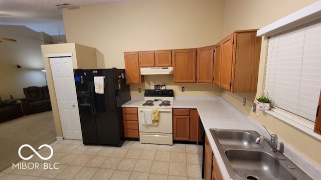 kitchen featuring black refrigerator with ice dispenser, white electric stove, and sink