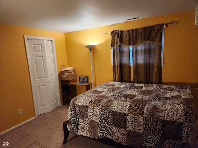 carpeted bedroom featuring a closet