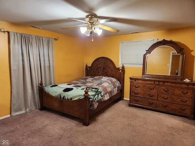 bedroom featuring light carpet and ceiling fan