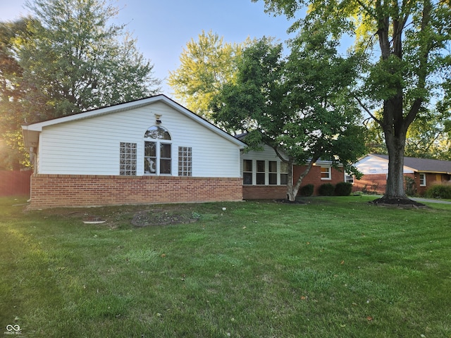 back of house with a yard