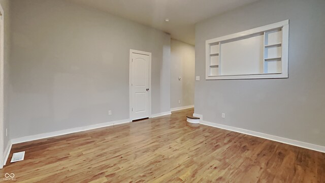 unfurnished room featuring light hardwood / wood-style flooring