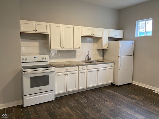 kitchen featuring light stone countertops, dark wood-type flooring, white appliances, sink, and white cabinetry