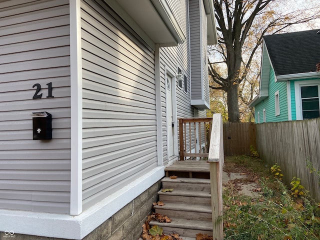 view of side of home with a wooden deck