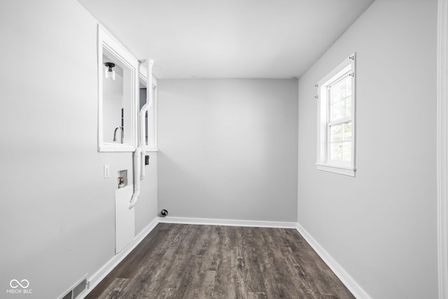 laundry room featuring dark hardwood / wood-style floors and washer hookup