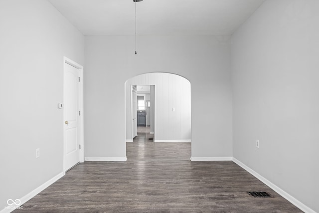 empty room featuring dark hardwood / wood-style flooring