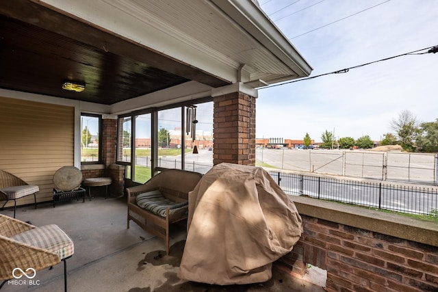 view of patio / terrace featuring an outdoor hangout area and fence