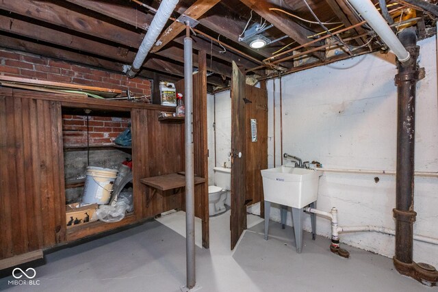unfinished basement featuring a sink