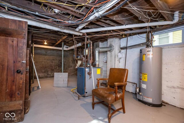 below grade area featuring a heating unit and gas water heater