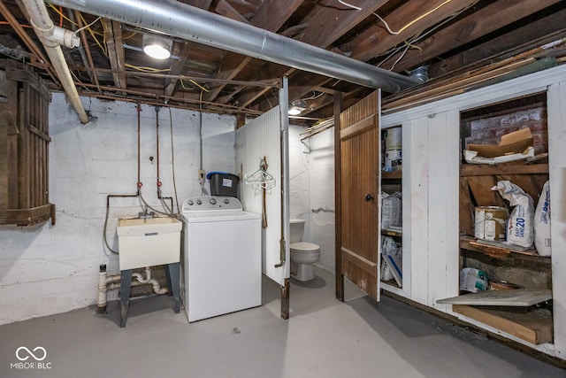 basement with washer / dryer and sink